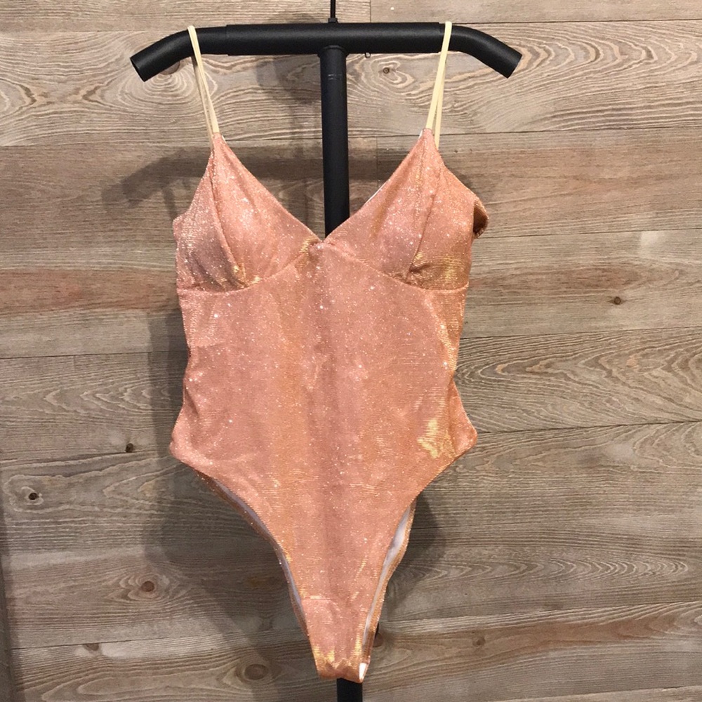 Gold metallic one piece swim suit. New without tags. XL